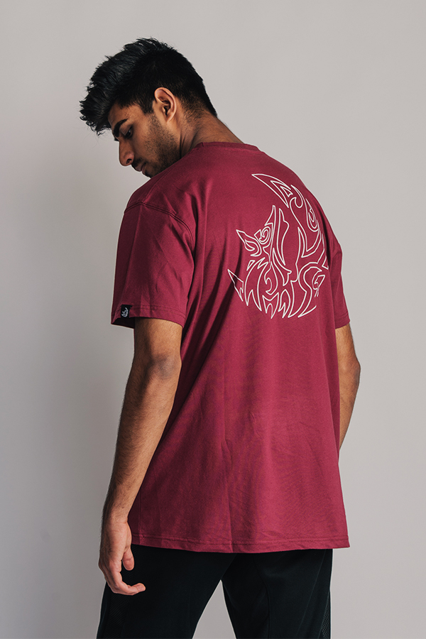 Danial wearing an Essential T-Shirt in the Color Maroon of our own collection